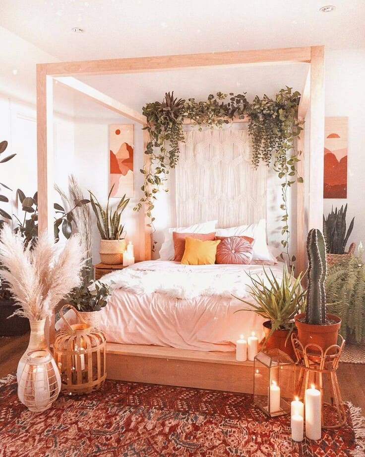 Cozy bohemian bedroom with greenery, pampas grass, and soft candlelight