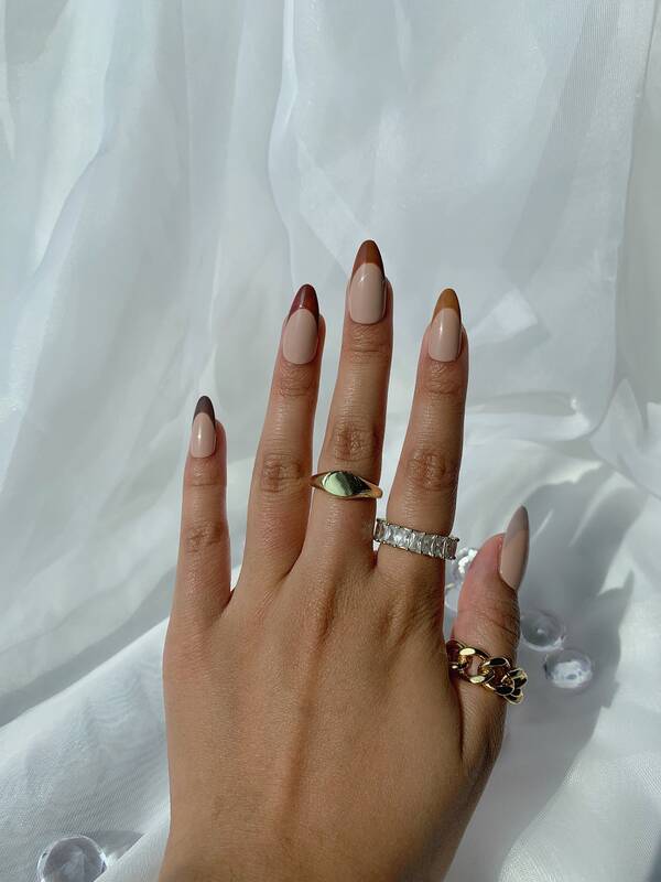 Brown colored french tip nails