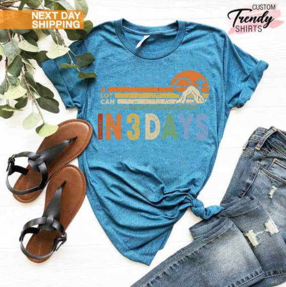 He is Risen shirt displayed with sandals and jeans