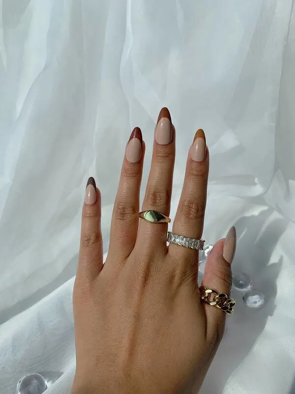 Brown colored french tip nails