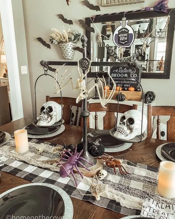 Cathedral-style scale centerpiece with skulls and spooky décor.