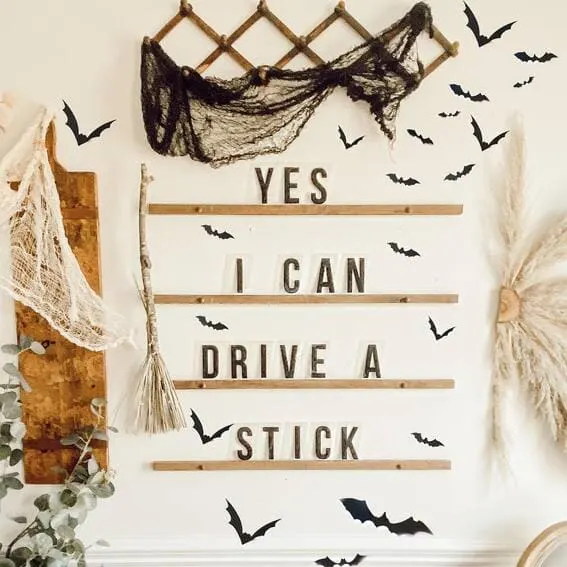 Playful wall decor with a witchy quote and bats.