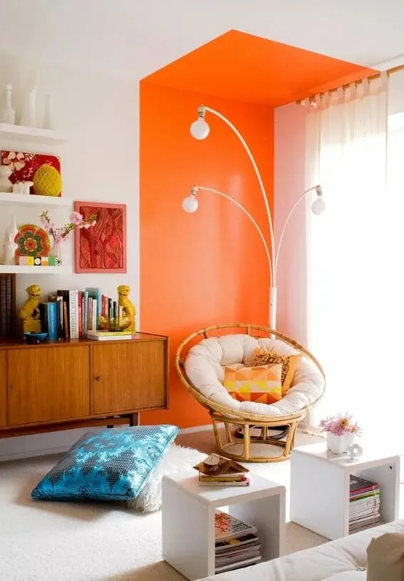 This is another colour pallete example when bold colors (like tangerine) can really make an impact in a living room.