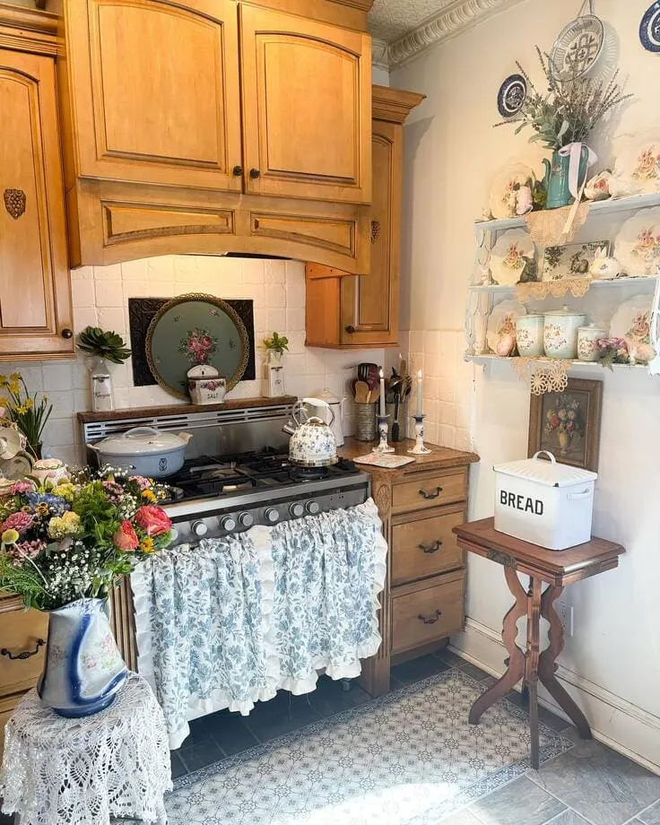 Cozy French country kitchen with floral fabrics and vintage dishes